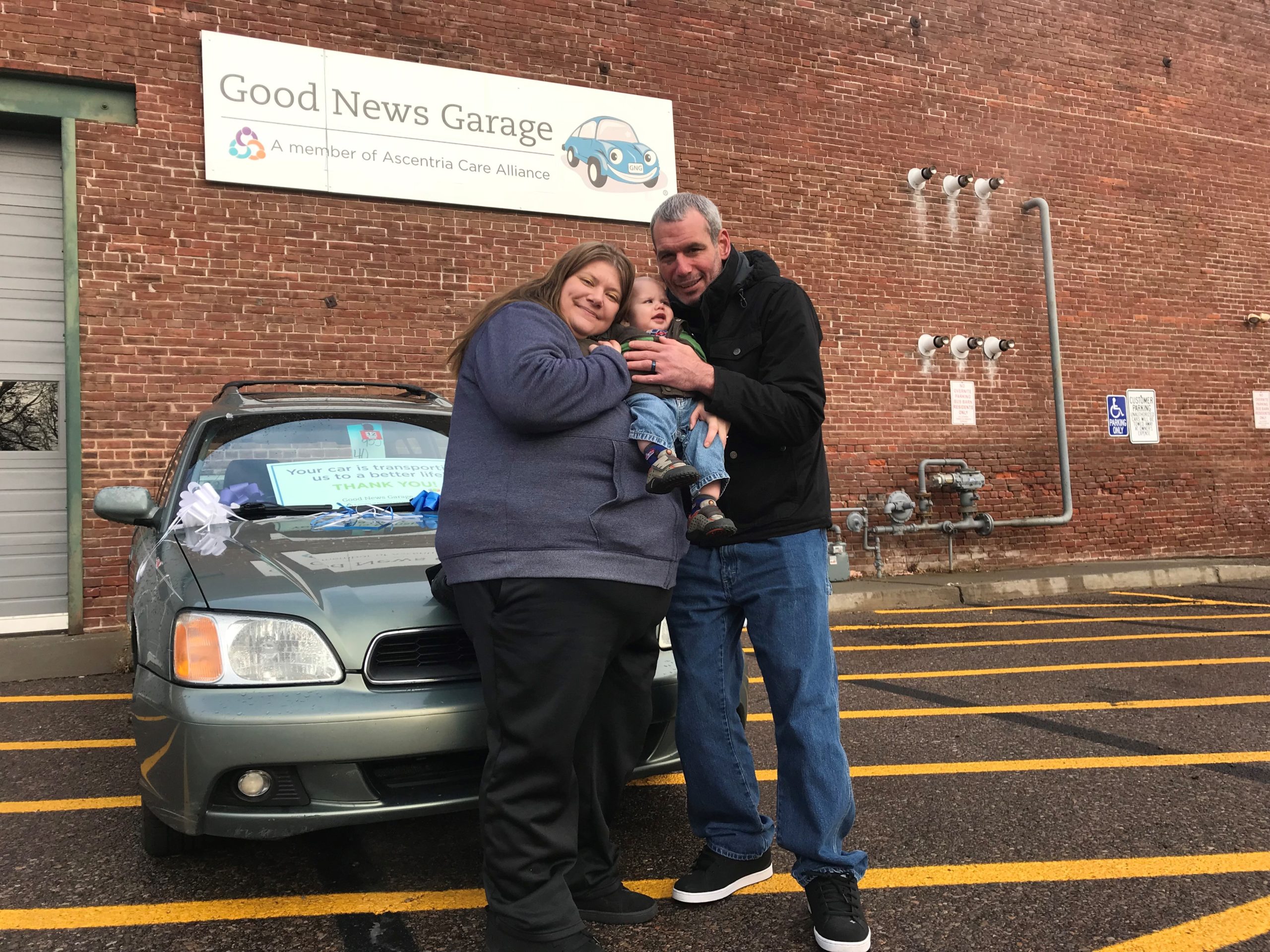 Our 5,000th car recipient pose for a photo.