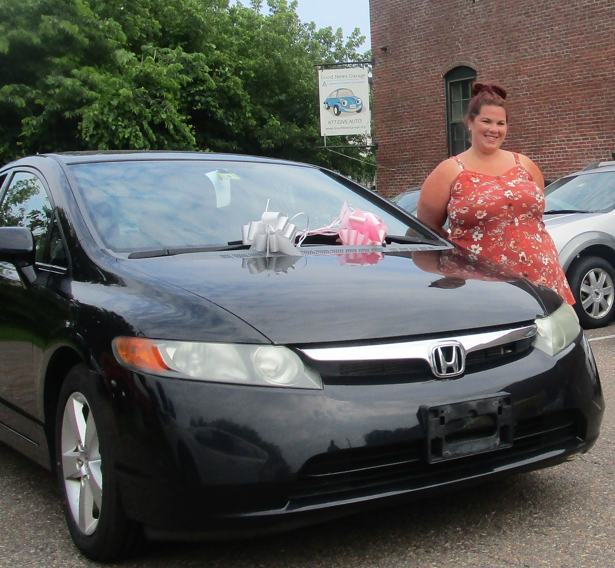Caitlin poses with her new GNG car