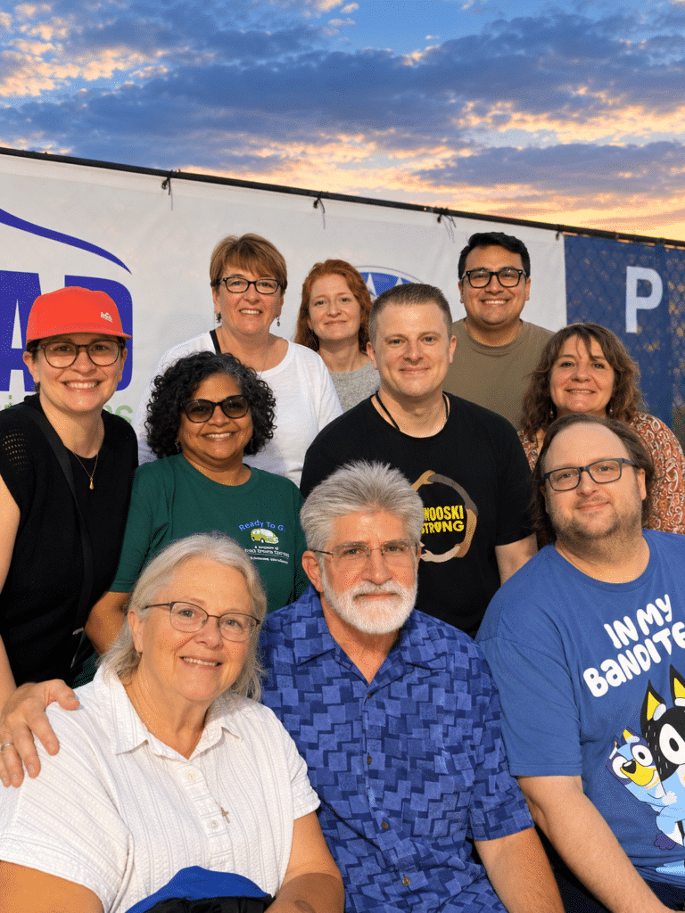 Good News Garage staff enjoys a night out watching their colleague, Stephanie, compete in the Demo Derby.